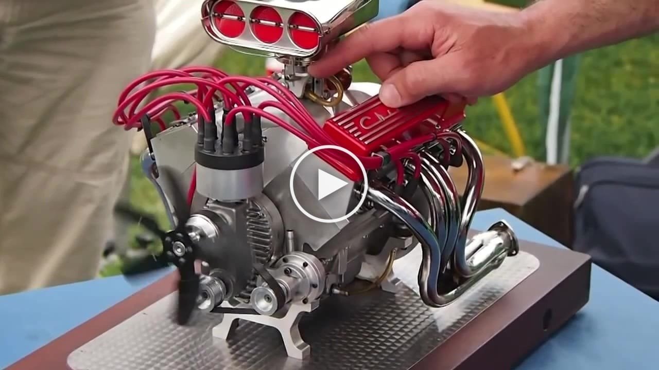 Old Lister with 4 cylinder hand crank engine starting up Canvids